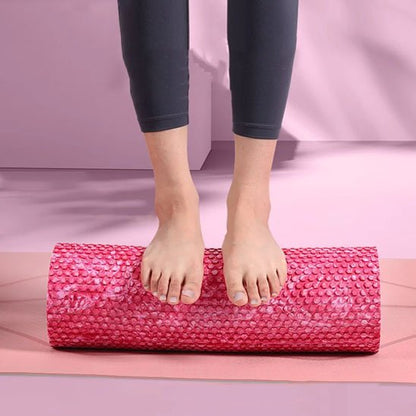 Rouleau de massage utilisé sous les pieds pour soulager tensions
